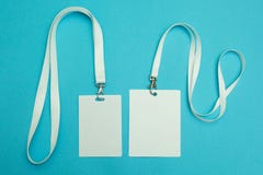 Two name tags on a blue background. Space for text and design stock photos Two name tags on a blue background. Space for text and design stock photos