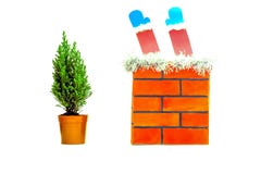On a white isolated background red brick pipe and a small live Christmas tree stock images On a white isolated background red brick pipe and a small live Christmas tree stock images