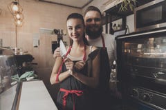 Two professional bakers are standing near oven. royalty free stock photos Two professional bakers are standing near oven. royalty free stock photos