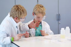 Two school boys during chemistry class Royalty Free Stock Photos Two school boys during chemistry class Royalty Free Stock Photos