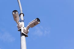 Two security cameras on blue sky royalty free stock image Two security cameras on blue sky royalty free stock image