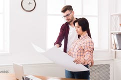 Two serious architects discussing building plan Royalty Free Stock Image Two serious architects discussing building plan Royalty Free Stock Image
