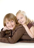 Two Sisters Posing - Vertical Royalty Free Stock Photos Two Sisters Posing - Vertical Royalty Free Stock Photos