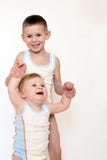 Two Small Boys In Identical Clothes Royalty Free Stock Image