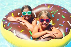 Two small girls having fun in pool Stock Photography Two small girls having fun in pool Stock Photography
