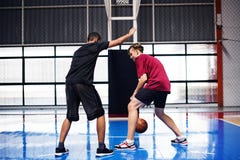 Two teenage boys playing basketball together on the court stock photos Two teenage boys playing basketball together on the court stock photos