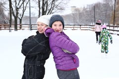 Two teenager girl on the snowy white background stock images Two teenager girl on the snowy white background stock images