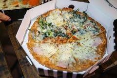 Two top up faces pizza in pizza box stock photography Two top up faces pizza in pizza box stock photography