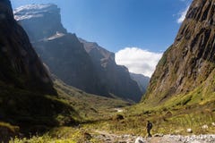 Two trekkers walking through glacier valley in Annapurna Base Camp trekking stock images Two trekkers walking through glacier valley in Annapurna Base Camp trekking stock images