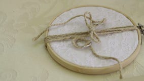 Two wedding rings on creative prop stock footage