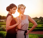 Two well-dressed woman in beautiful park. royalty free stock photo Two well-dressed woman in beautiful park. royalty free stock photo