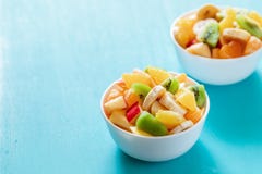 Two White Bowls Of Fresh Fruit Salad On Turquoise Table. Royalty Free Stock Photo Two White Bowls Of Fresh Fruit Salad On Turquoise Table. Royalty Free Stock Photo
