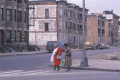 Two women crossing street in ghetto, South Bronx, New York royalty free stock photography Two women crossing street in ghetto, South Bronx, New York royalty free stock photography