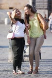 Two women smiling doing a selfie with phone stock images Two women smiling doing a selfie with phone stock images