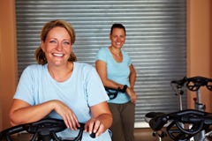 Two women in spinning room Stock Image Two women in spinning room Stock Image
