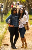 Two young African girls enjoying a day out at The Winter Sculpture Fair at Nirox Sculpture Park royalty free stock image Two young African girls enjoying a day out at The Winter Sculpture Fair at Nirox Sculpture Park royalty free stock image
