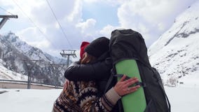 Two young excited women travelers happily hug each other in Dolomites stock video Two young excited women travelers happily hug each other in Dolomites stock video
