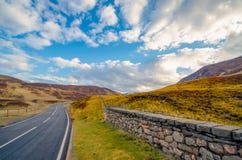 A typical main road through a scottish Glen leading through the stock photography A typical main road through a scottish Glen leading through the stock photography