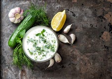 Tzatziki sauce ingredients cucumber, garlic, dill Food background stock photo Tzatziki sauce ingredients cucumber, garlic, dill Food background stock photo