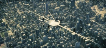 UAV armed reconnaissance and attack drone flying high above a metropolitan city. royalty free stock photo UAV armed reconnaissance and attack drone flying high above a metropolitan city. royalty free stock photo