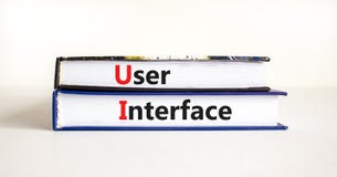 UI user interface symbol. Concept words UI user interface on books on a beautiful white table white background, copy space.