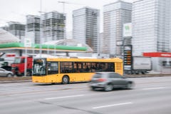 Ukraine, Kyiv - 15 January 2022: Yellow public transport bus car moving on the street. Editorial