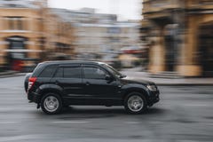 Ukraine, Kyiv - 2 June 2021: Black Suzuki Grand Vitara car moving on the street. Editorial