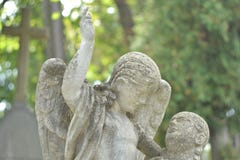 Ukraine, Lviv, Lychakivskiy Cemetery-September 26, 2011: Stone monument statue in the shape of an angel and human stock photos Ukraine, Lviv, Lychakivskiy Cemetery-September 26, 2011: Stone monument statue in the shape of an angel and human stock photos