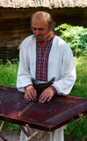 A Ukrainian peasant Plays the Tsymbaly Royalty Free Stock Photography A Ukrainian peasant Plays the Tsymbaly Royalty Free Stock Photography