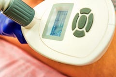 Woman gets anti-cellulite and anti-fat therapy in beauty salon royalty free stock image Woman gets anti-cellulite and anti-fat therapy in beauty salon royalty free stock image