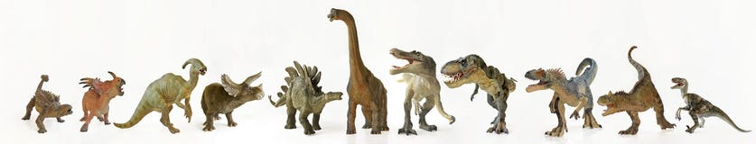 Un groupe d'onze dinosaures dans une rangée Un groupe d'onze dinosaures dans une rangée