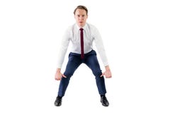 Un homme d'affaires sérieux soulevant quelque chose Image stock Un homme d'affaires sérieux soulevant quelque chose Image stock