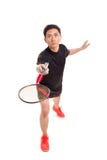 Un jugador asiático masculino del bádminton en un partido fotografía de archivo Un jugador asiático masculino del bádminton en un partido fotografía de archivo