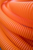 Un mazzo di tubi di plastica arancio fotografie stock Un mazzo di tubi di plastica arancio fotografie stock