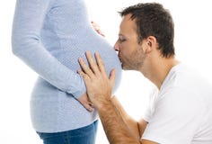 Un ventre de femme enceinte avec le futur père au-dessus du fond blanc photographie stock Un ventre de femme enceinte avec le futur père au-dessus du fond blanc photographie stock