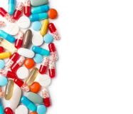 Una vista superiore di un mucchio delle pillole colourful della medicina e le capsule su bianco sorgono Immagini Stock Una vista superiore di un mucchio delle pillole colourful della medicina e le capsule su bianco sorgono Immagini Stock