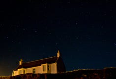 Under Starry Skies. Port of Ness, nighttime with the plough or Big Dipper Stock Photos Under Starry Skies. Port of Ness, nighttime with the plough or Big Dipper Stock Photos