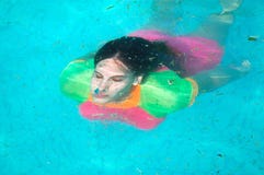 Under water portrait of woman diving