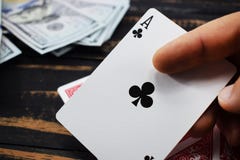 Underground casino, play cards for money caught ace Royalty Free Stock Image Underground casino, play cards for money caught ace Royalty Free Stock Image