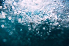 Underwater waves in tropical sea and sun rays. Water texture in ocean stock images Underwater waves in tropical sea and sun rays. Water texture in ocean stock images
