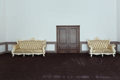 Une salle avec deux sofas de vintage d'or photos libres de droits Une salle avec deux sofas de vintage d'or photos libres de droits