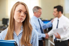 Unhappy Businesswoman With Male Colleague Being Congratulated stock photos Unhappy Businesswoman With Male Colleague Being Congratulated stock photos