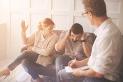Unhappy married couple having an argument royalty free stock photography Unhappy married couple having an argument royalty free stock photography