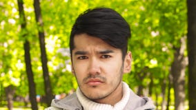 Unhappy serious man looking in camera stock video Unhappy serious man looking in camera stock video