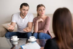 Unhappy young family couple with a problem at psychologist offic royalty free stock photo Unhappy young family couple with a problem at psychologist offic royalty free stock photo