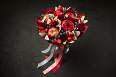 Unique Composition In The Form Of A Bouquet Of Pomegranates, Apples, Strawberries, Red Currants And Roses Stock Images