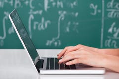University student using laptop in classroom