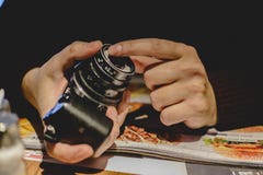 Unknown person holding a Camera with a vintage lens. Unknown person holding a Camera with a vintage lens Stock Photos Unknown person holding a Camera with a vintage lens. Unknown person holding a Camera with a vintage lens Stock Photos