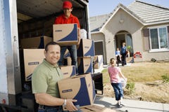 Unloading Delivery Van In Front Of House stock photos Unloading Delivery Van In Front Of House stock photos