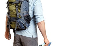Unrecognizable Male Traveler With A Backpack Looking Into The Distance, Rear View Isolated. Adventure Destination Concept stock photo Unrecognizable Male Traveler With A Backpack Looking Into The Distance, Rear View Isolated. Adventure Destination Concept stock photo